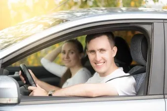 young-smiling-man-driving-and-woman-sitting-in-the-car_1163-2672.jpg